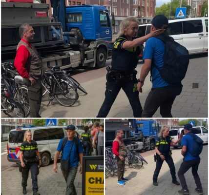 Politieagente controleert de realiteit van koppige vluchtelingen en geeft ze midden op straat een klap in het gezicht.